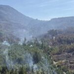 Smoke rising from wildfire in British Columbia forest during 2026 fire season