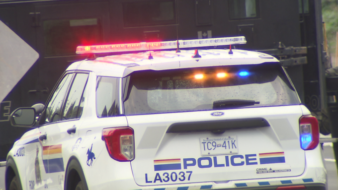 RCMP officers investigating a crash involving a stolen truck in Langley