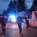 Police vehicles responding to a reported assault investigation in Surrey, British Columbia.