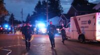 Police vehicles responding to a reported assault investigation in Surrey, British Columbia.