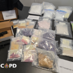 Evidence and seized illegal drugs displayed during a Victoria police enforcement operation in British Columbia.