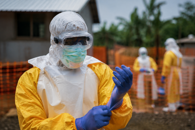 Healthcare workers wearing protective suits during an Ebola outbreak response in Central Africa