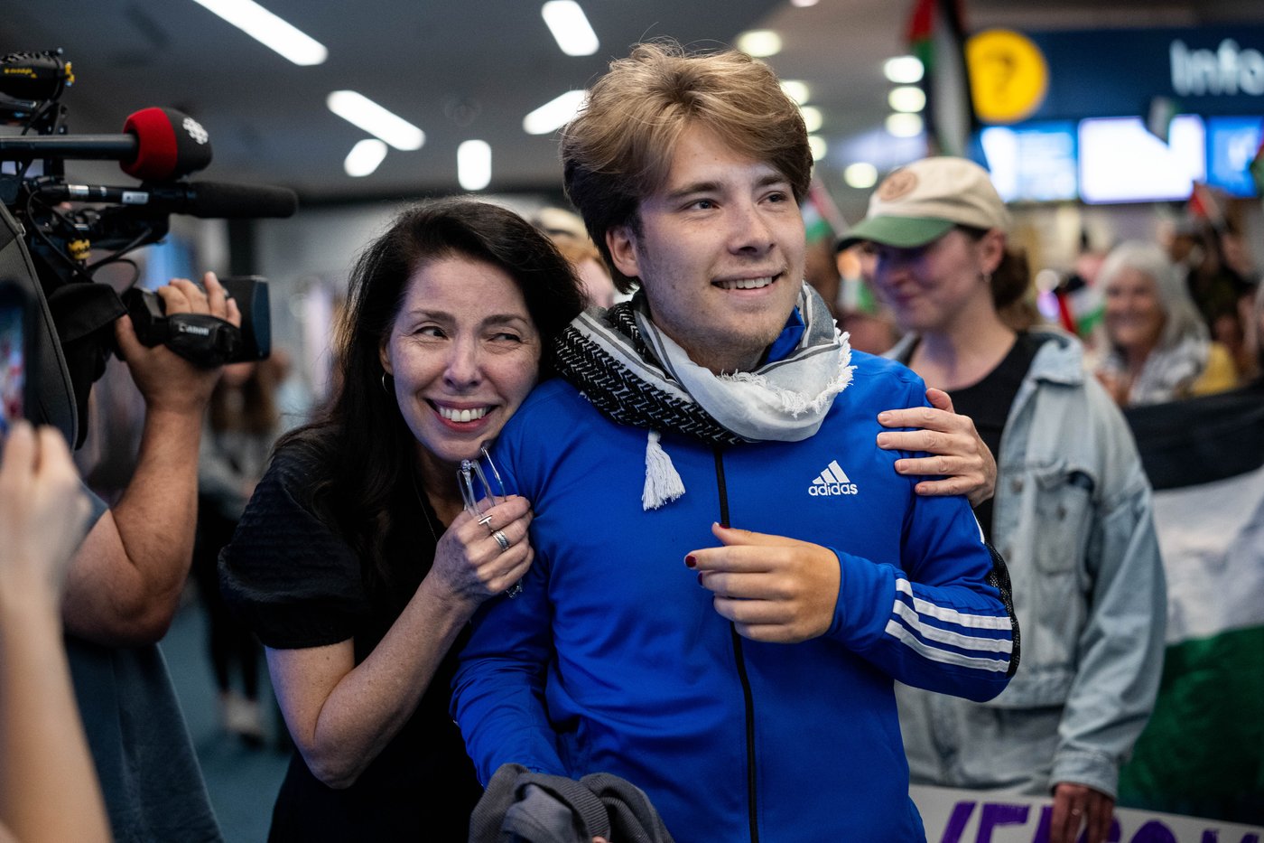 Three Vancouver activists arriving home after detention during a Gaza-bound humanitarian flotilla mission intercepted by Israeli authorities.