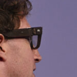 Person wearing modern smart glasses with AI-powered wearable technology features