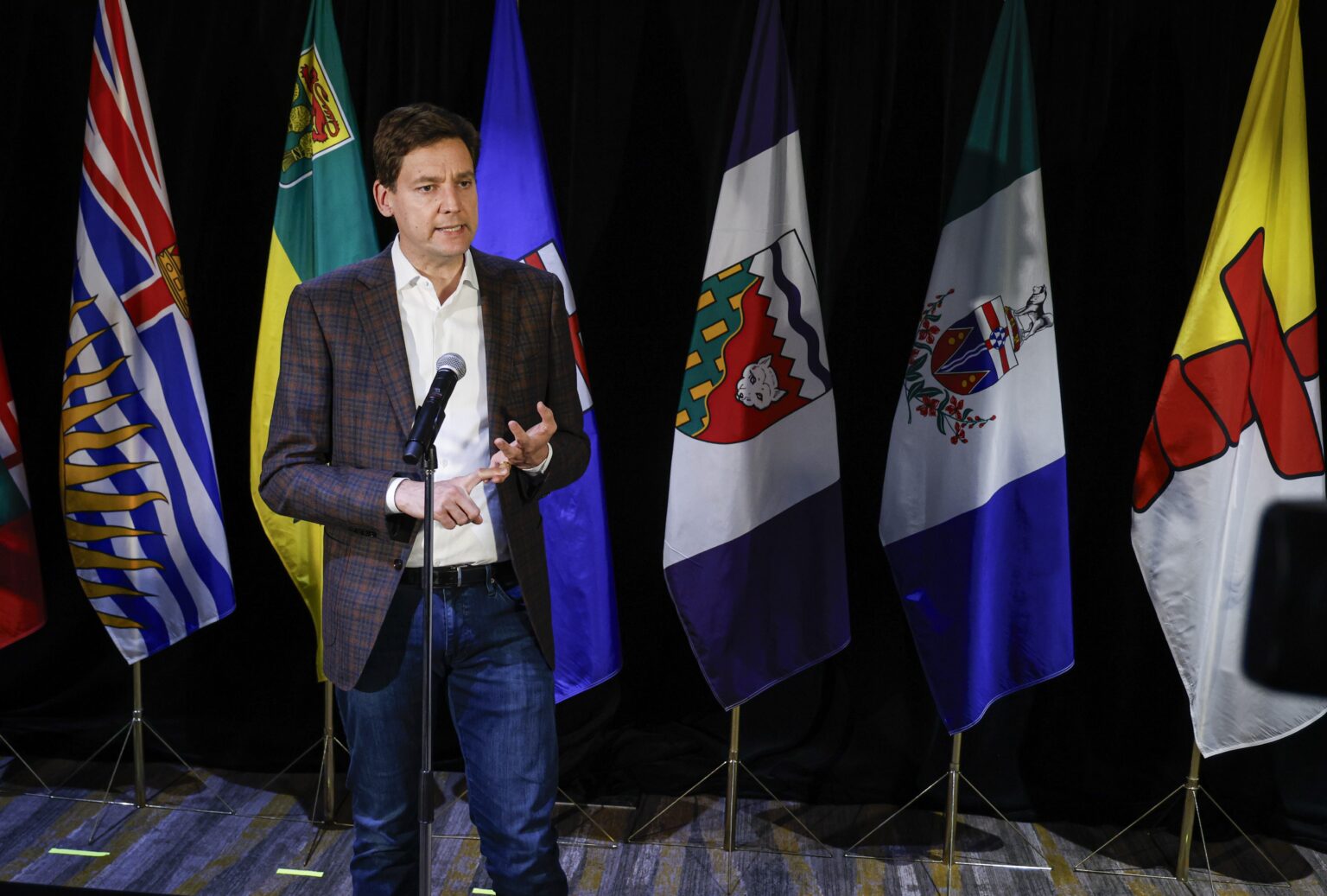 Alberta Premier Danielle Smith speaking during a political event about Alberta separation and western Canada issues.