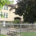 Police vehicles parked near a Vancouver elementary school during an investigation into an attempted child abduction.