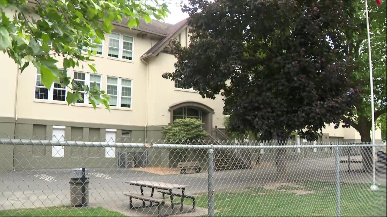 Police vehicles parked near a Vancouver elementary school during an investigation into an attempted child abduction.