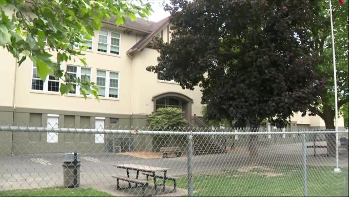Police vehicles parked near a Vancouver elementary school during an investigation into an attempted child abduction.