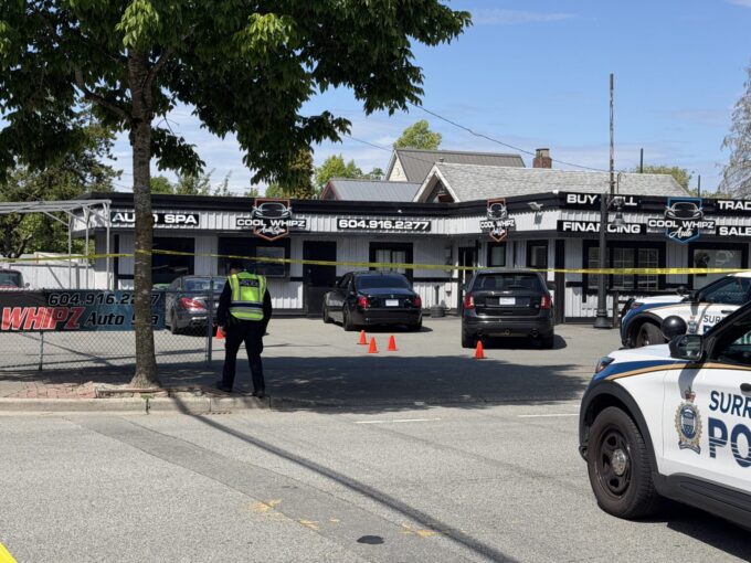 Police vehicles and crime scene tape at shooting investigation in Cloverdale Surrey