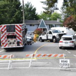 Police and emergency crews investigating a fatal motor vehicle collision on Fraser Highway in Langley, British Columbia.