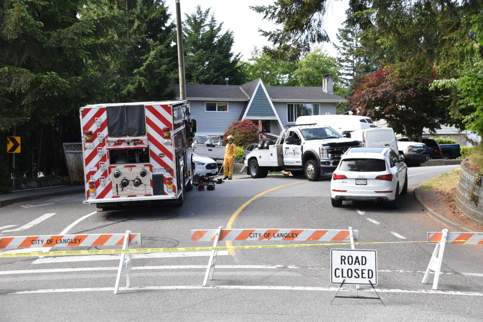 Police and emergency crews investigating a fatal motor vehicle collision on Fraser Highway in Langley, British Columbia.