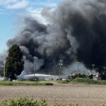 Firefighters battling a large barn fire in Delta, British Columbia