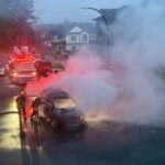 Firefighters battling a burning vehicle after an explosion in Surrey’s Newton neighbourhood.