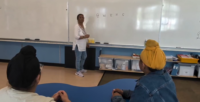 Students and parents discussing a Punjabi language initiative at a British Columbia elementary school amid online debate.