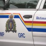 Police officers responding to an investigation scene in Richmond, British Columbia following a reported arrest.