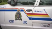 Police officers responding to an investigation scene in Richmond, British Columbia following a reported arrest.