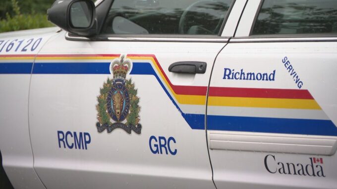 Police officers responding to an investigation scene in Richmond, British Columbia following a reported arrest.