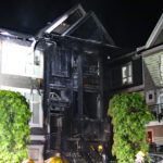 Firefighters responding to a major townhouse fire in Surrey that left one residential unit heavily damaged.