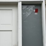 Police officers investigating a Surrey home after a gunfire incident connected to an extortion investigation.