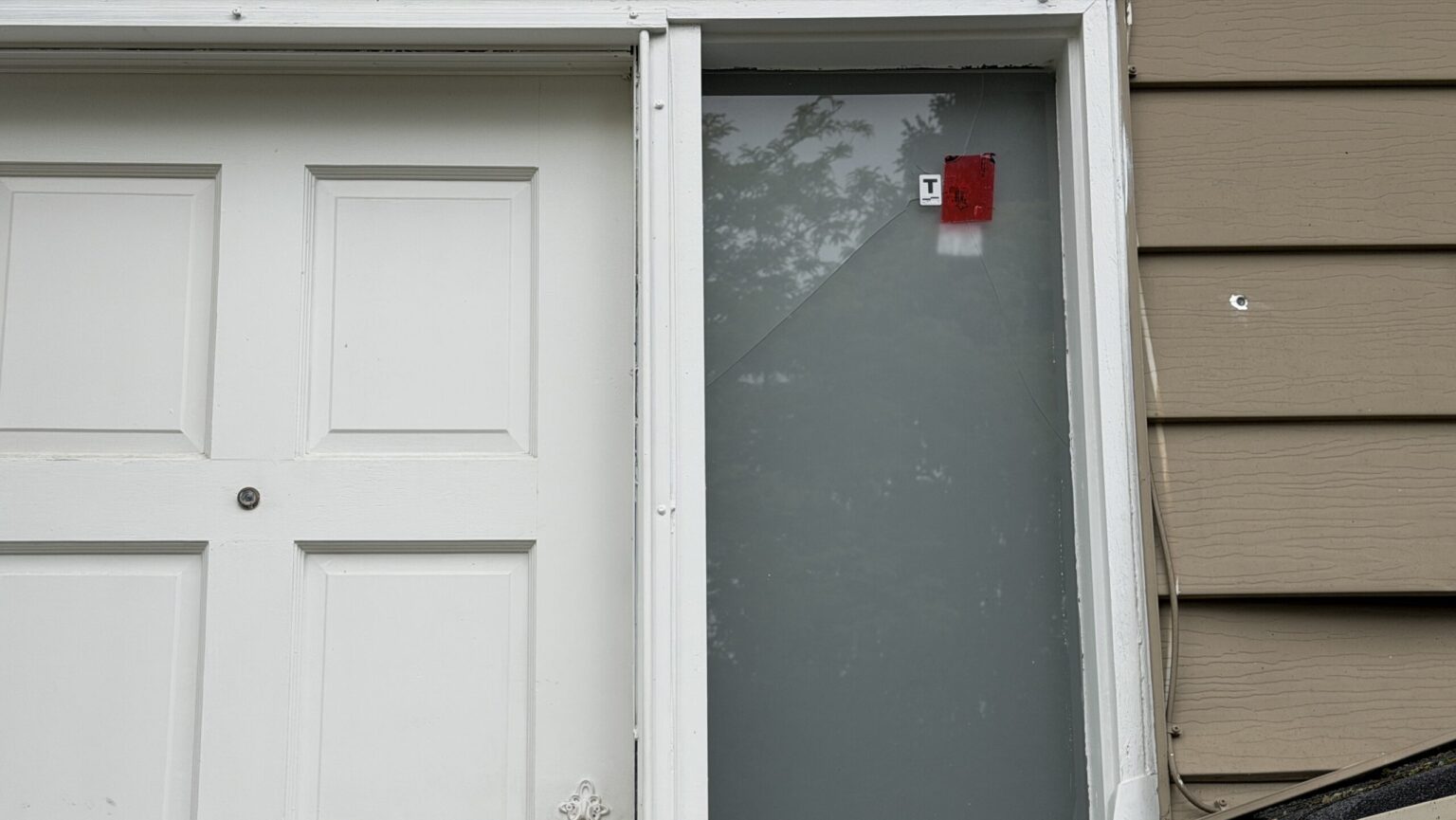 Police officers investigating a Surrey home after a gunfire incident connected to an extortion investigation.