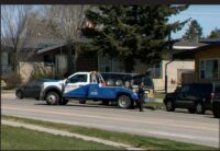 Police officers investigating a residential area in Calgary after a tragic incident involving children