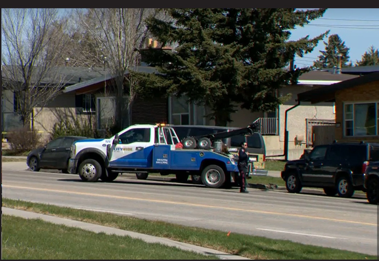 Police officers investigating a residential area in Calgary after a tragic incident involving children