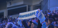 Vancouver Whitecaps supporters gather outside BC Place Stadium during campaigns to keep the MLS club in Vancouver amid relocation concerns.