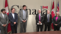 Large LNG facility and pipeline infrastructure in British Columbia connected to upcoming natural gas investment decisions in Canada.
