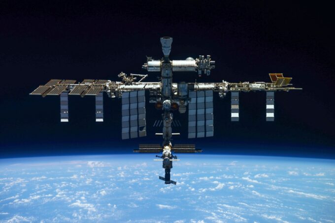 Interior view of International Space Station modules representing NASA emergency response to suspected air leak in orbit.