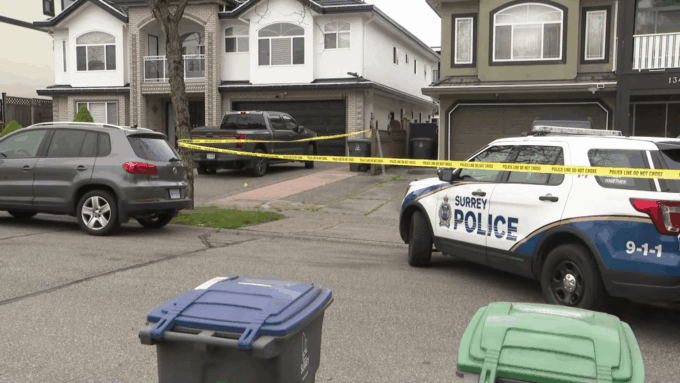 Surrey police investigating an extortion-linked shooting that resulted in additional criminal charges against two suspects.