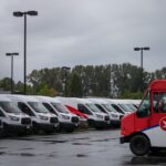 Canada Post delivery trucks and workers as negotiations continue on a tentative labour agreement in Canada.