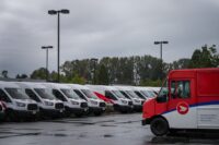Canada Post delivery trucks and workers as negotiations continue on a tentative labour agreement in Canada.
